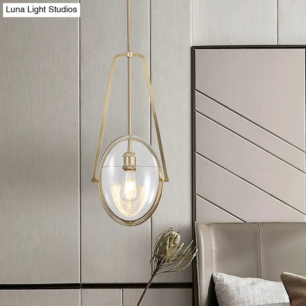 Modern Brass Pendant Light with Clear Glass Shade and Unique Halberd Frame