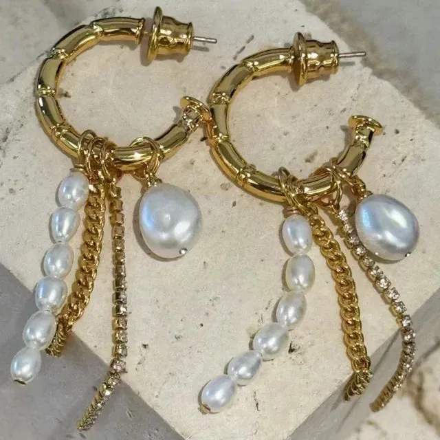 Pre Order: Skeletal C-Shaped Pearl And Chain Dangle Earrings